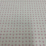 100% coton Os en X fond rose pâle