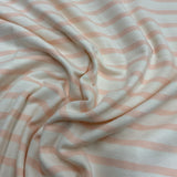 **-40%*   Jersey coton / élasthanne  ligné rose pêche