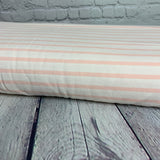 **-40%*   Jersey coton / élasthanne  ligné rose pêche