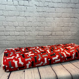 Jersey coton / élasthanne Chien saucisse fond rouge - 1573691